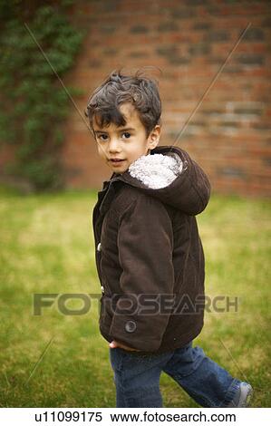 Boy walking in garden View Large Photo Image Stock Photography - Boy walking in garden. Fotosearch