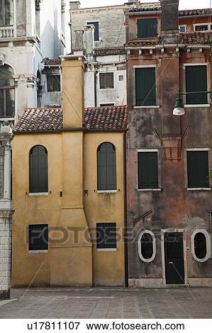 Stock Photo - Buildings with shuttered windows. Fotosearch