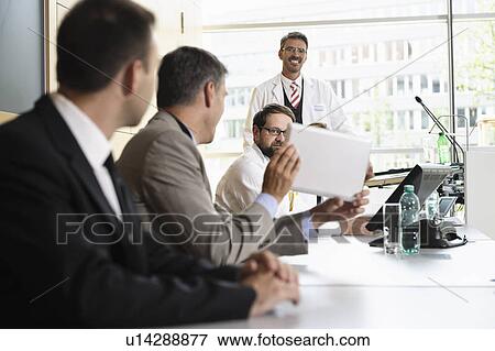 Stock Photo - Businessman using tablet computer. Fotosearch