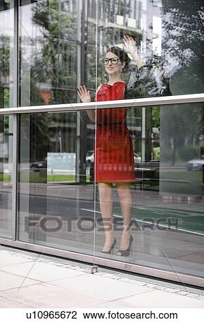 Businesswoman looking out window View Large Photo Image Stock Image - Businesswoman looking out window. Fotosearch
