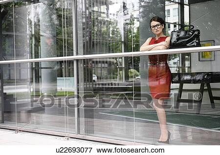 Businesswoman looking out window View Large Photo Image Stock Photo - Businesswoman looking out window. Fotosearch