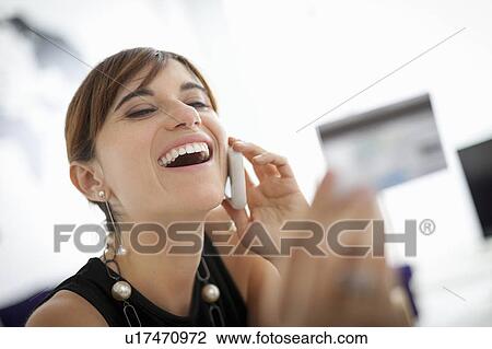 Businesswoman shopping on phone View Large Photo Image Stock Image - Businesswoman shopping on phone. Fotosearch