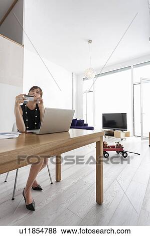Businesswoman shopping online View Large Photo Image Stock Photo - Businesswoman shopping online. Fotosearch