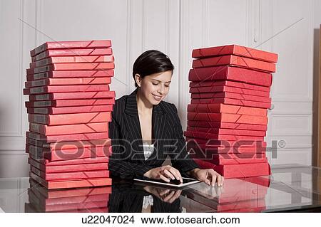 Businesswoman with stacks of folders View Large Photo Image Picture - Businesswoman with stacks of folders. Fotosearch