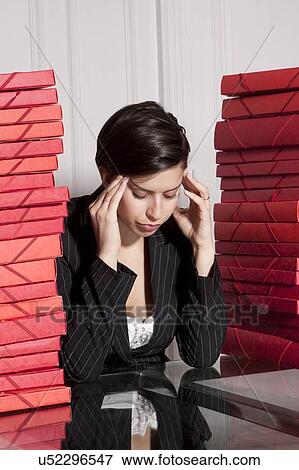 Stock Photo - Businesswoman with stacks of folders. Fotosearch