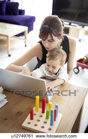 Businesswoman working at home View Large Photo Image Stock Image - Businesswoman working at home. Fotosearch