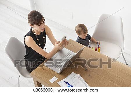 Businesswoman working at home View Large Photo Image Stock Image - Businesswoman working at home. Fotosearch