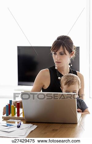 Businesswoman working at home View Large Photo Image Stock Photography - Businesswoman working at home. Fotosearch