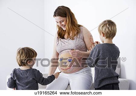 Picture - Children drawing on pregnant mother. Fotosearch
