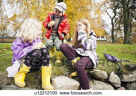 Stock Image - Children playing together outdoors. Fotosearch