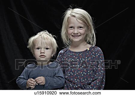 Children posing together indoors View Large Photo Image Stock Image - Children posing together indoors. Fotosearch