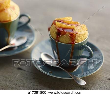 Stock Image - Close up of baked dessert in cup. Fotosearch