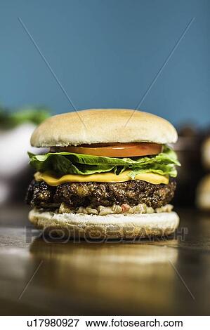 Close up of cheeseburger View Large Photo Image Stock Photo - Close up of cheeseburger. Fotosearch