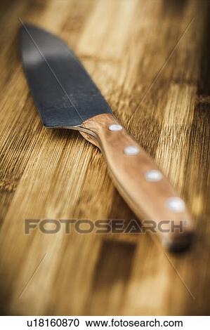 Close up of knife on wooden table View Large Photo Image Stock Image - Close up of knife on wooden table. Fotosearch