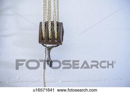 Stock Image - Close up of rope and hook. Fotosearch