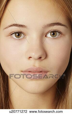 Stock Image - Close up of teenage girls face. Fotosearch
