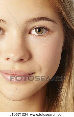 Picture - Close up of teenage girls smiling face. Fotosearch