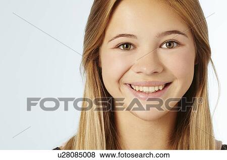 Stock Photo - Close up of teenage girls smiling face. Fotosearch