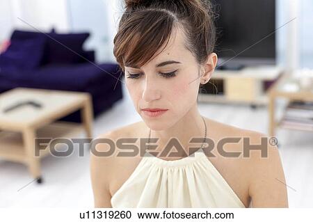 Stock Image - Close up of womans sad face. Fotosearch