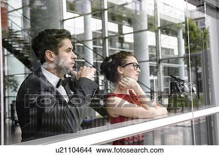 Picture - Couple looking out window. Fotosearch