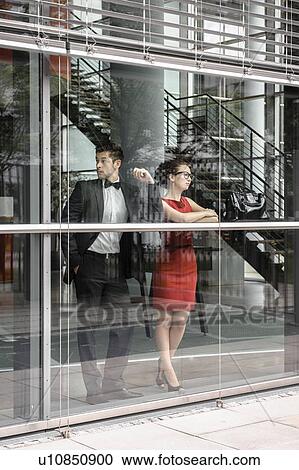 Couple looking out window View Large Photo Image Stock Image - Couple looking out window. Fotosearch