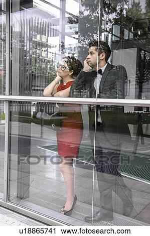 Stock Image - Couple looking out window. Fotosearch