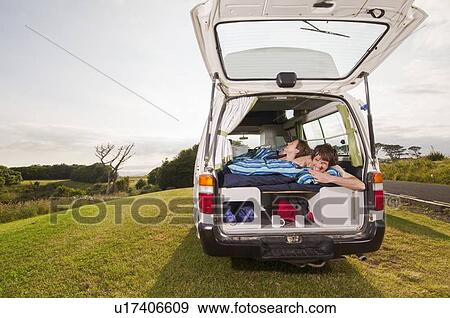 Couple under comforter in trailer View Large Photo Image Stock Photo - Couple under comforter in trailer. Fotosearch