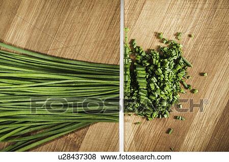Diptych of whole and chopped chives View Large Photo Image Stock Photo - Diptych of whole and chopped chives. Fotosearch