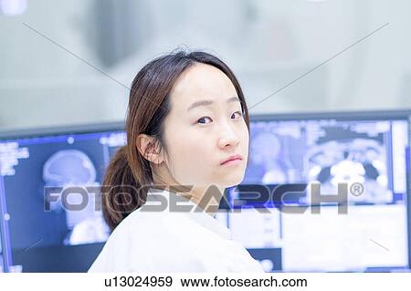 Doctor at x-ray scanning station View Large Photo Image Stock Photo - Doctor at x-ray scanning station. Fotosearch