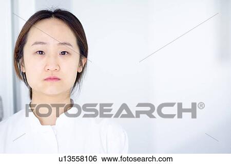 Stock Photograph - Doctor standing in hospital. Fotosearch