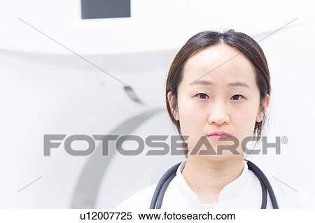 Stock Photography - Doctor standing in hospital. Fotosearch