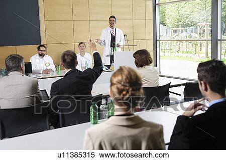 Doctors giving talk in conference room View Large Photo Image Stock Photography - Doctors giving talk in conference room. Fotosearch