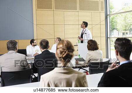 Doctors giving talk in conference room View Large Photo Image Stock Photography - Doctors giving talk in conference room. Fotosearch