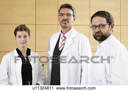 Doctors smiling together View Large Photo Image Stock Image - Doctors smiling together. Fotosearch