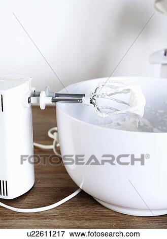 Electric mixer with whipped cream View Large Photo Image Stock Photo - Electric mixer with whipped cream. Fotosearch