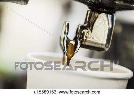 Espresso pouring from machine into cup View Large Photo Image Stock Image - Espresso pouring from machine into cup. Fotosearch