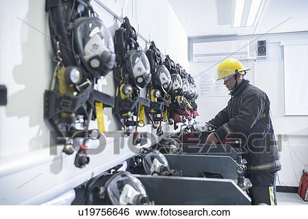 Stock Photograph - Firefighter in training room. Fotosearch