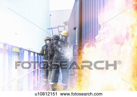 Firefighters in simulation training View Large Photo Image Stock Image - Firefighters in simulation training. Fotosearch