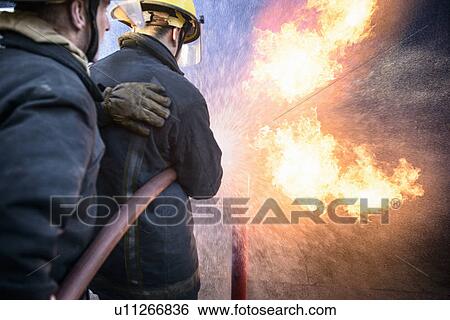 Firefighters in simulation training View Large Photo Image Stock Photograph - Firefighters in simulation training. Fotosearch