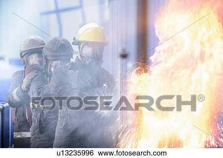 Firefighters in simulation training View Large Photo Image Stock Photograph - Firefighters in simulation training. Fotosearch