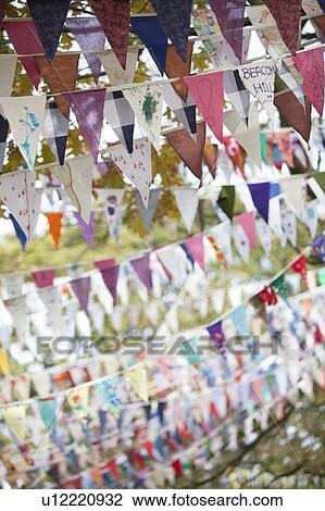 Stock Image - Flags flying against autumn leaves. Fotosearch