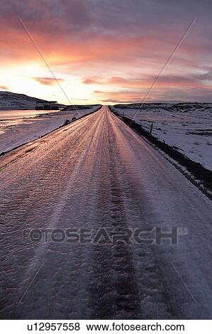 Frozen road in snowy landscape View Large Photo Image Stock Photo - Frozen road in snowy landscape. Fotosearch