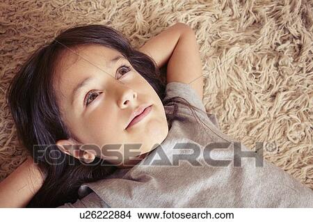 Girl laying on shag carpet View Large Photo Image Picture - Girl laying on shag carpet. Fotosearch