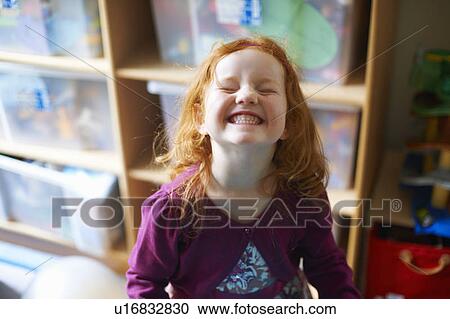 Girl making face in playroom View Large Photo Image Stock Image - Girl making face in playroom. Fotosearch
