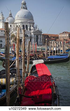 Stock Photo - Gondolas docked on Venice canal. Fotosearch