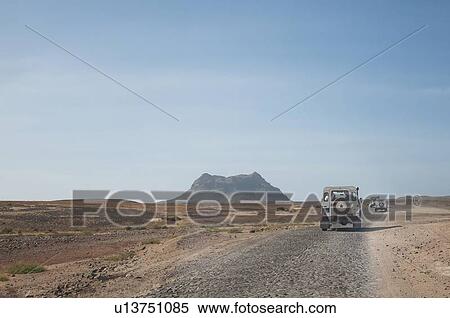 Jeeps driving in dusty landscape View Large Photo Image Stock Photography - Jeeps driving in dusty landscape. Fotosearch
