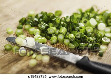 Stock Photography - Knife with chopped green onions. Fotosearch