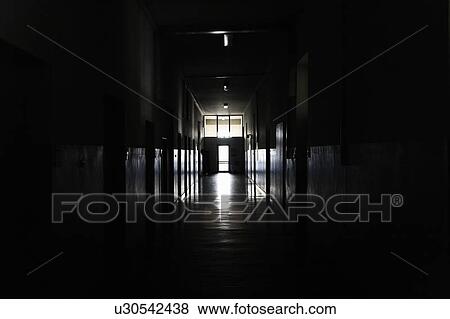 Light shining from door in dark hallway View Large Photo Image Stock Photo - Light shining from door in dark hallway. Fotosearch
