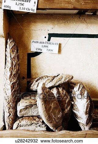 Loaves of bread for sale in bakery View Large Photo Image Stock Image - Loaves of bread for sale in bakery. Fotosearch