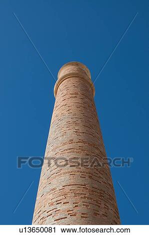 Stock Image - Low angle view of smokestack. Fotosearch